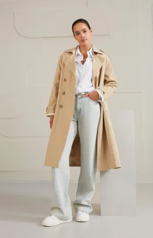 Double breasted trench coat with long sleeves, pockets and belt